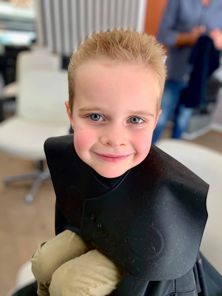 blond boy after haircut