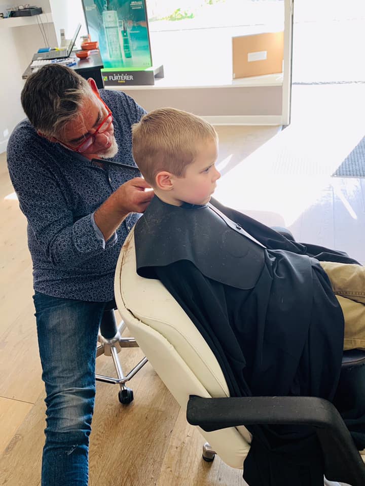 child getting haircut